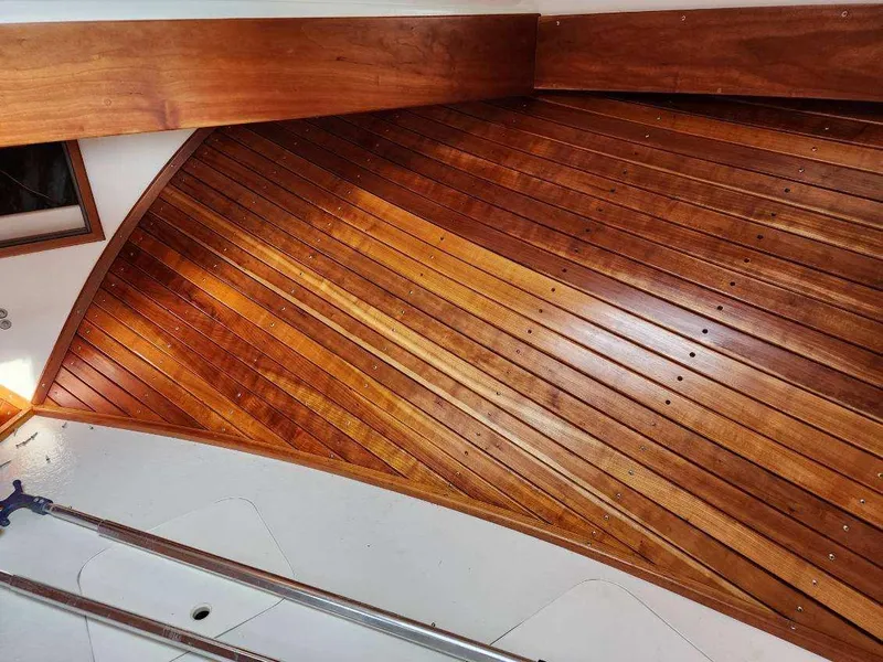Slide: The Image of Wooden interior of 2016 Custom Broad Creek 32 Downeast boat, showcasing polished craftsmanship. - 26