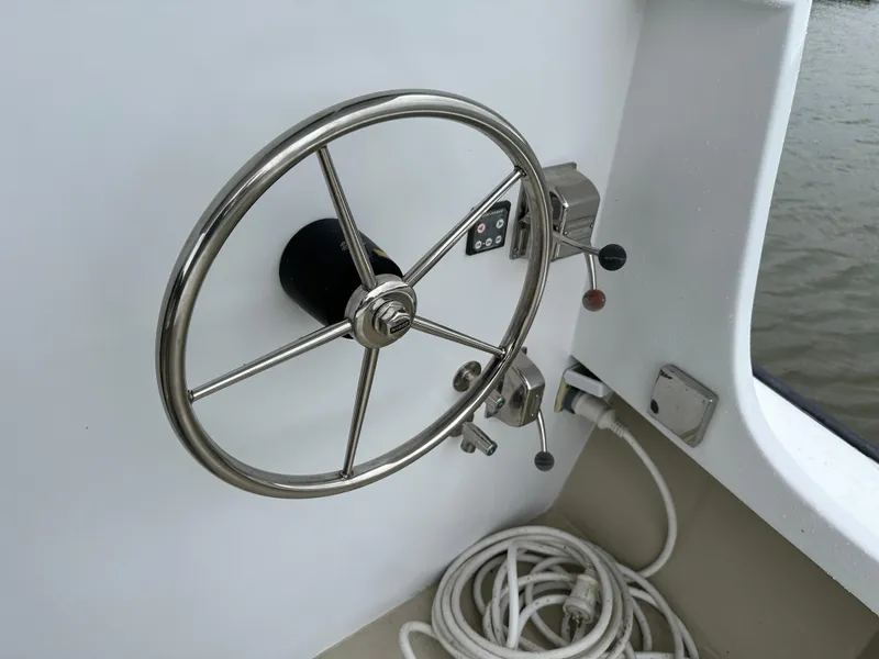 Slide: The Image of Stainless steel steering wheel on 2016 Custom Broad Creek 32 Downeast boat. - 31