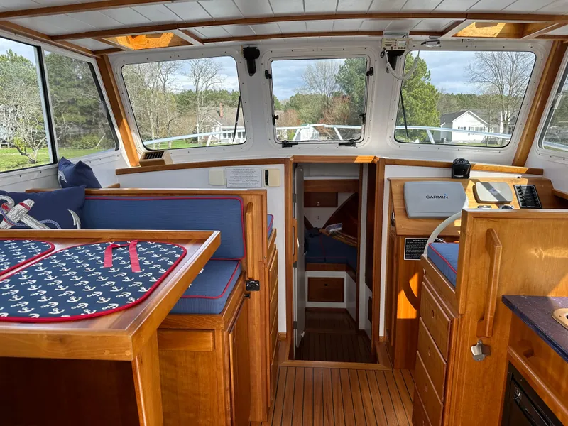 Slide: The Image of Interior of 2016 Custom Broad Creek 32 Downeast boat with wood finish and nautical decor. - 7