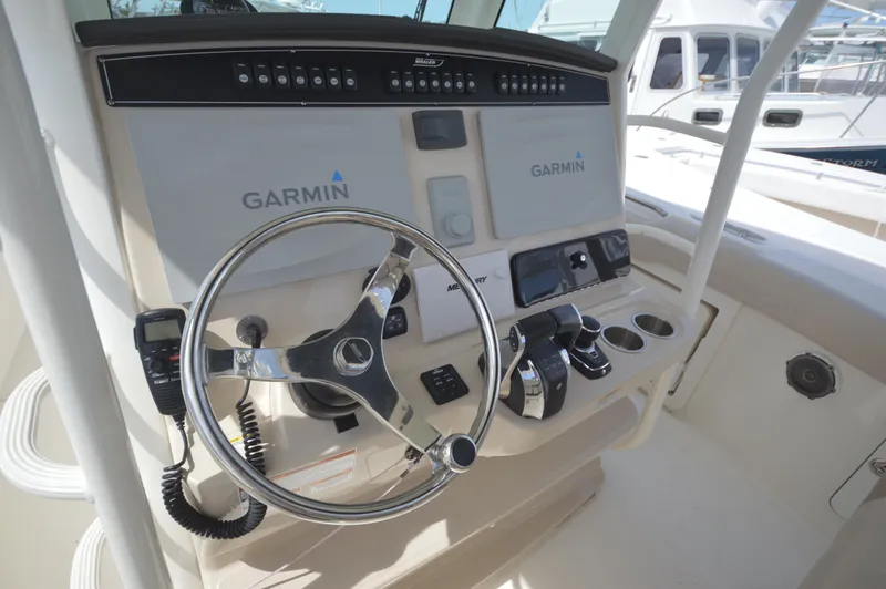 Slide: The Image of 2018 Boston Whaler 330 Outrage helm with Garmin navigation system. - 13