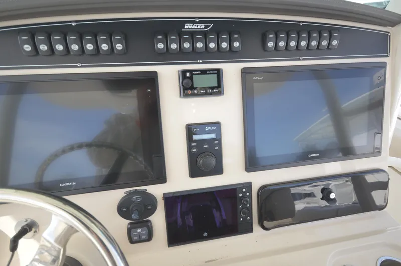 Slide: The Image of Control panel of a 2018 Boston Whaler 330 Outrage boat with Garmin displays. - 15