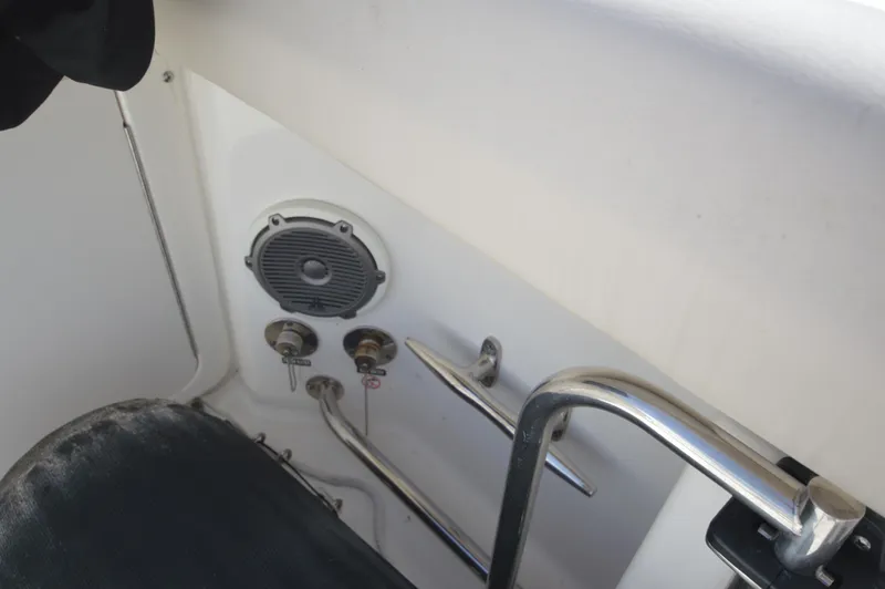 Slide: The Image of 2018 Boston Whaler 330 Outrage boat interior with speaker and control panel. - 23