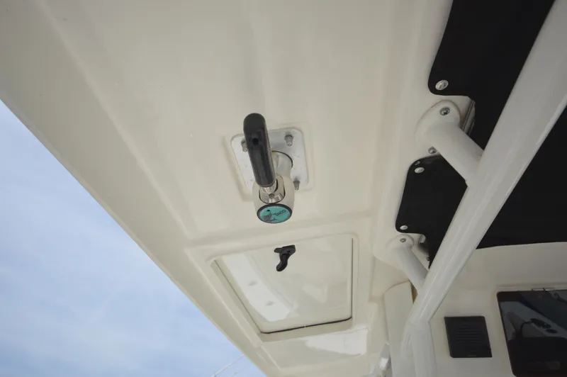 Slide: The Image of 2018 Boston Whaler 330 Outrage boat ceiling with mounted equipment. - 25