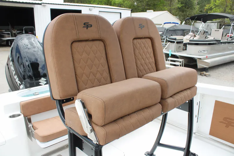 Slide: The Image of 2024 Sea Pro 222 boat with brown cushioned seats and diamond stitching. - 13