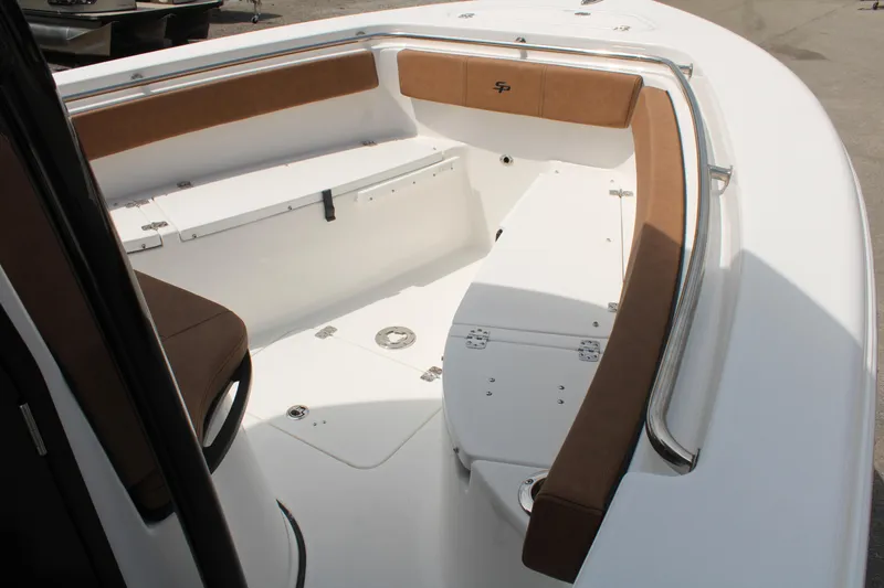 Slide: The Image of 2024 Sea Pro 222 boat interior with cushioned seating and storage compartments. - 16