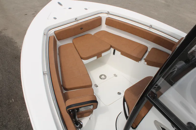 Slide: The Image of 2024 Sea Pro 222 boat with brown cushioned seating in the bow area. - 28