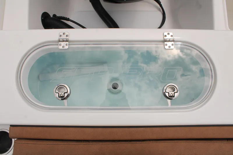 Slide: The Image of 2024 Sea Pro 222 boat livewell with clear lid and secure latches. - 9