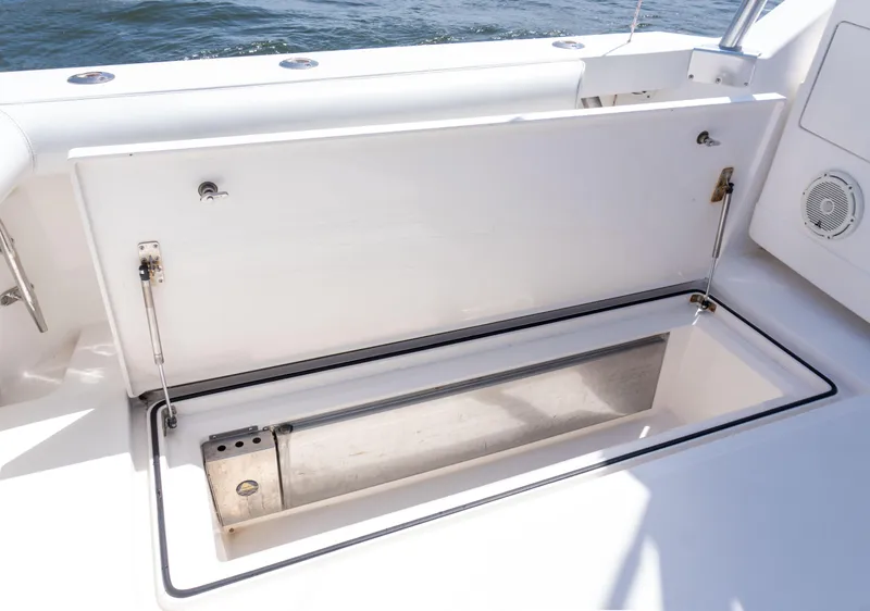 Slide: The Image of Open storage compartment on a 2008 Cabo 38 Express boat. - 13