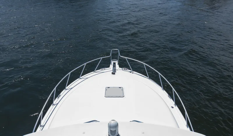 Slide: The Image of Bow view of 2008 Cabo 38 Express boat on water. - 27