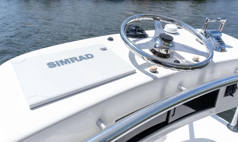 Slide: The Image of Helm of 2008 Cabo 38 Express boat with Simrad navigation system. - 28