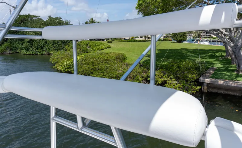 Slide: The Image of 2008 Cabo 38 Express boat with white cushioned seating on deck. - 29