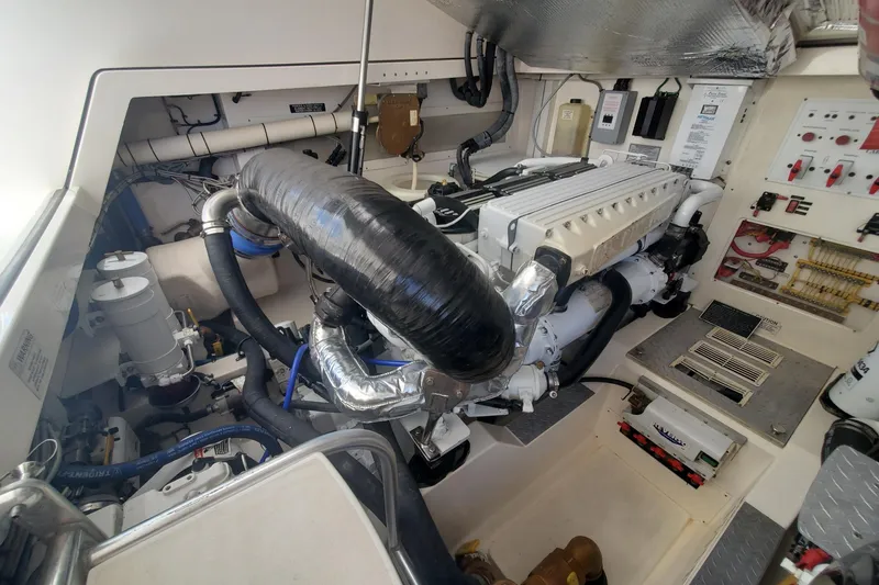 Slide: The Image of Engine room of a 2008 Cabo 38 Express boat with visible machinery and components. - 30