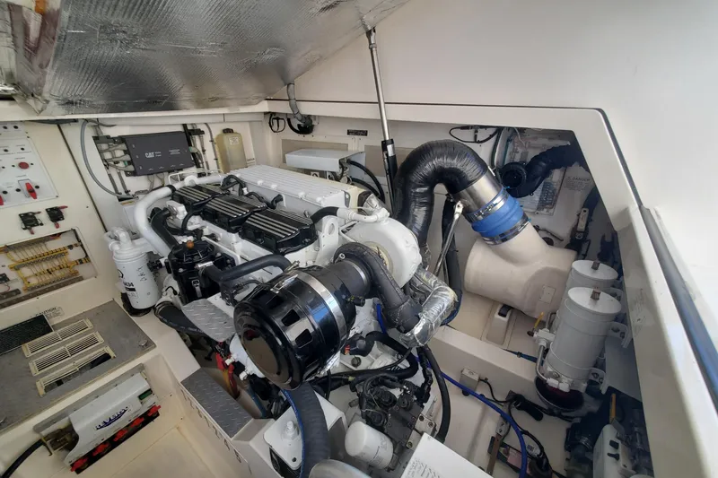 Slide: The Image of Engine room of a 2008 Cabo 38 Express boat with detailed components. - 31