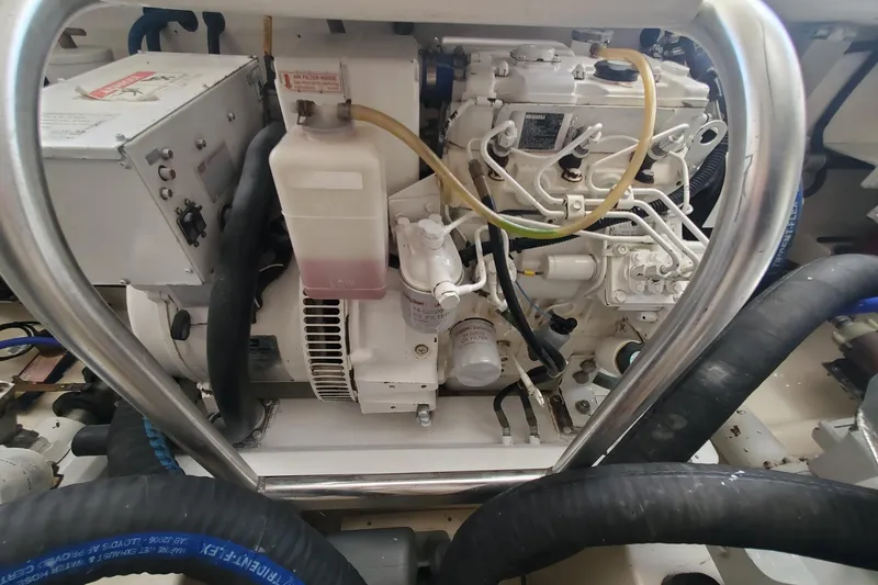 Slide: The Image of Engine compartment of a 2008 Cabo 38 Express boat with visible components and wiring. - 34