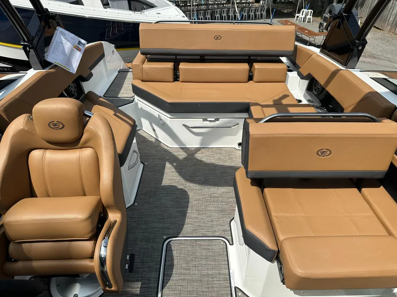 Slide: The Image of 2024 Cobalt R4 boat interior with tan leather seating and modern design. - 10