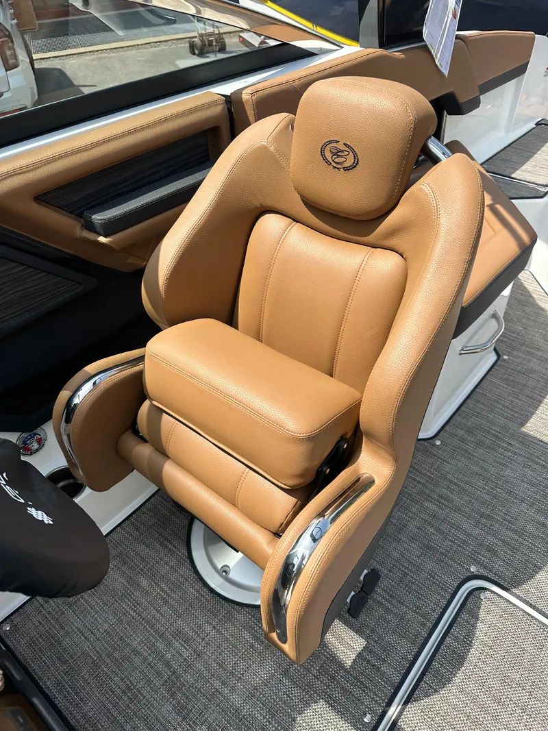 Slide: The Image of 2024 Cobalt R4 boat with luxurious tan leather captain's chair. - 11
