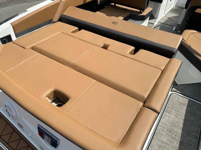 Slide: The Image of 2024 Cobalt R4 boat with tan leather seating and sun pad. - 14