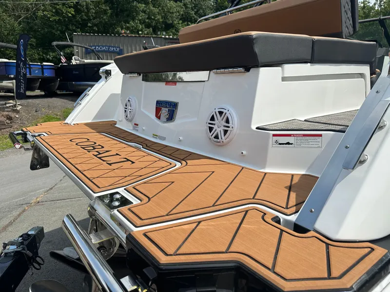 Slide: The Image of 2024 Cobalt R4 boat with teak swim platform and seating area. - 4