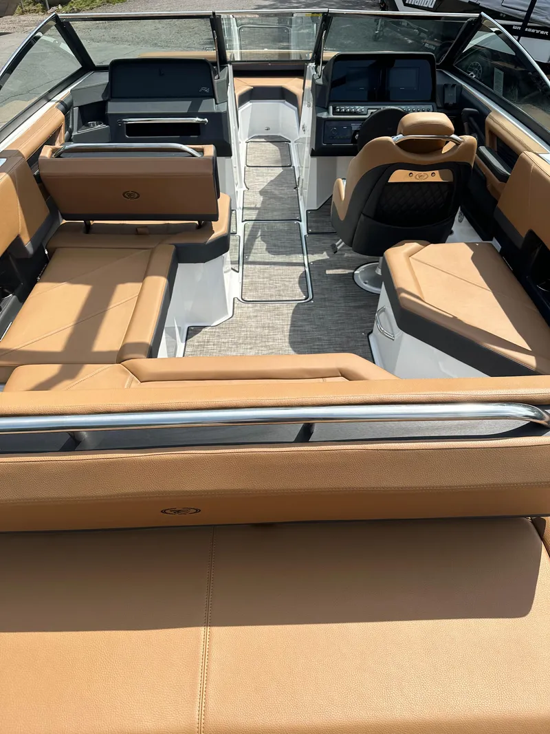 Slide: The Image of 2024 Cobalt R4 boat interior with tan leather seating and modern dashboard. - 5