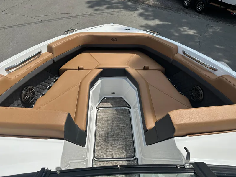 Slide: The Image of 2024 Cobalt R4 boat with tan leather seating and sleek design. - 6