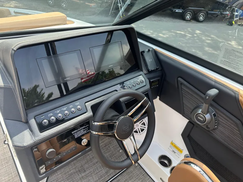 Slide: The Image of 2024 Cobalt R4 boat dashboard with dual screens and modern controls. - 7