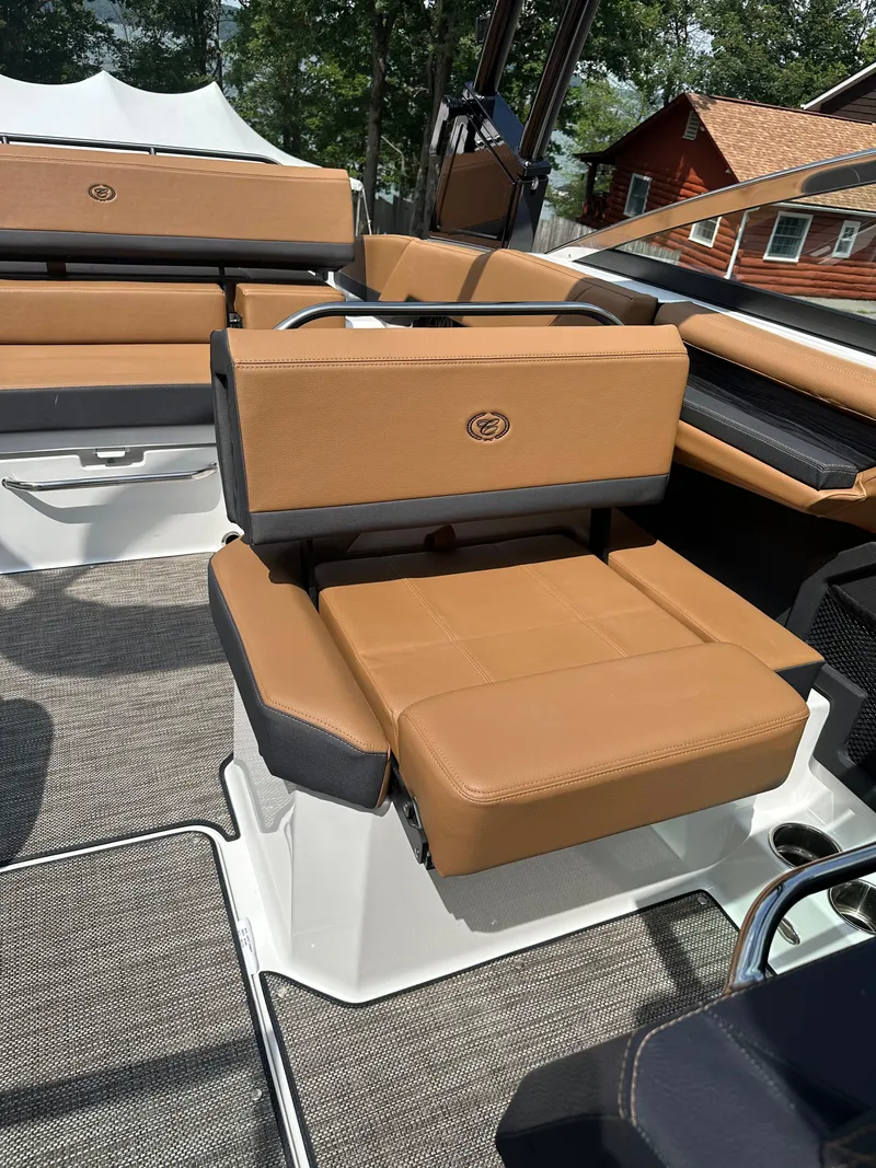 Slide: The Image of 2024 Cobalt R4 boat interior with tan leather seats and modern design. - 9
