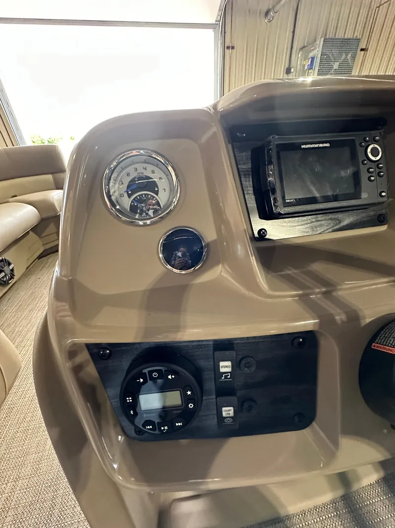 Slide: The Image of Control panel of 2024 Starcraft LX22RDH boat with gauges and navigation system. - 16