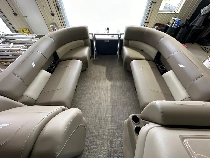 Slide: The Image of 2024 Starcraft LX22RDH pontoon boat interior with luxurious seating. - 2