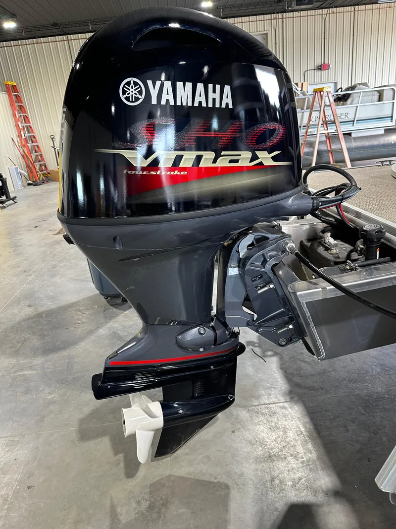 Slide: The Image of 2024 Starcraft LX22RDH with Yamaha VMAX outboard motor in a workshop. - 20