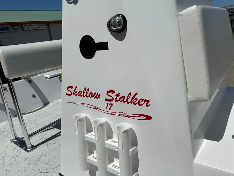 Slide: The Image of 2024 Shallow Stalker 17 LTS boat console with rod holders. - 13