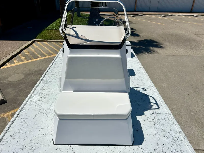 Slide: The Image of 2024 Shallow Stalker 17 LTS boat with white seating and console. - 14
