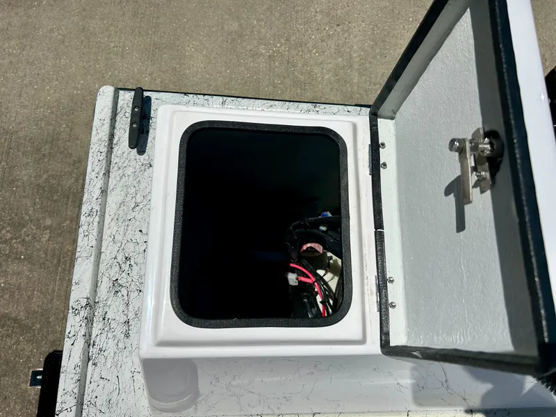 Slide: The Image of Open storage compartment of 2024 Shallow Stalker 17 LTS boat. - 6
