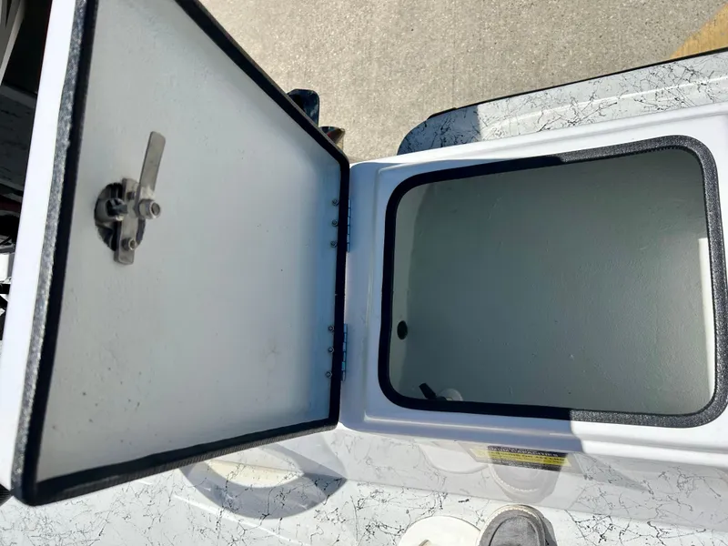 Slide: The Image of Open storage compartment on a 2024 Shallow Stalker 17 LTS boat. - 7