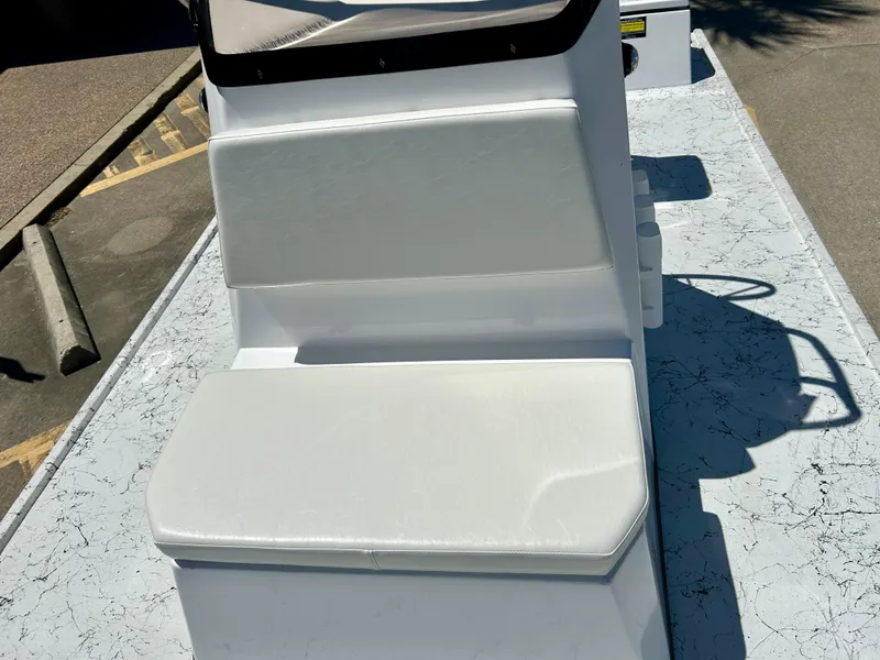 Slide: The Image of 2024 Shallow Stalker 17 LTS boat with white cushioned seating. - 9