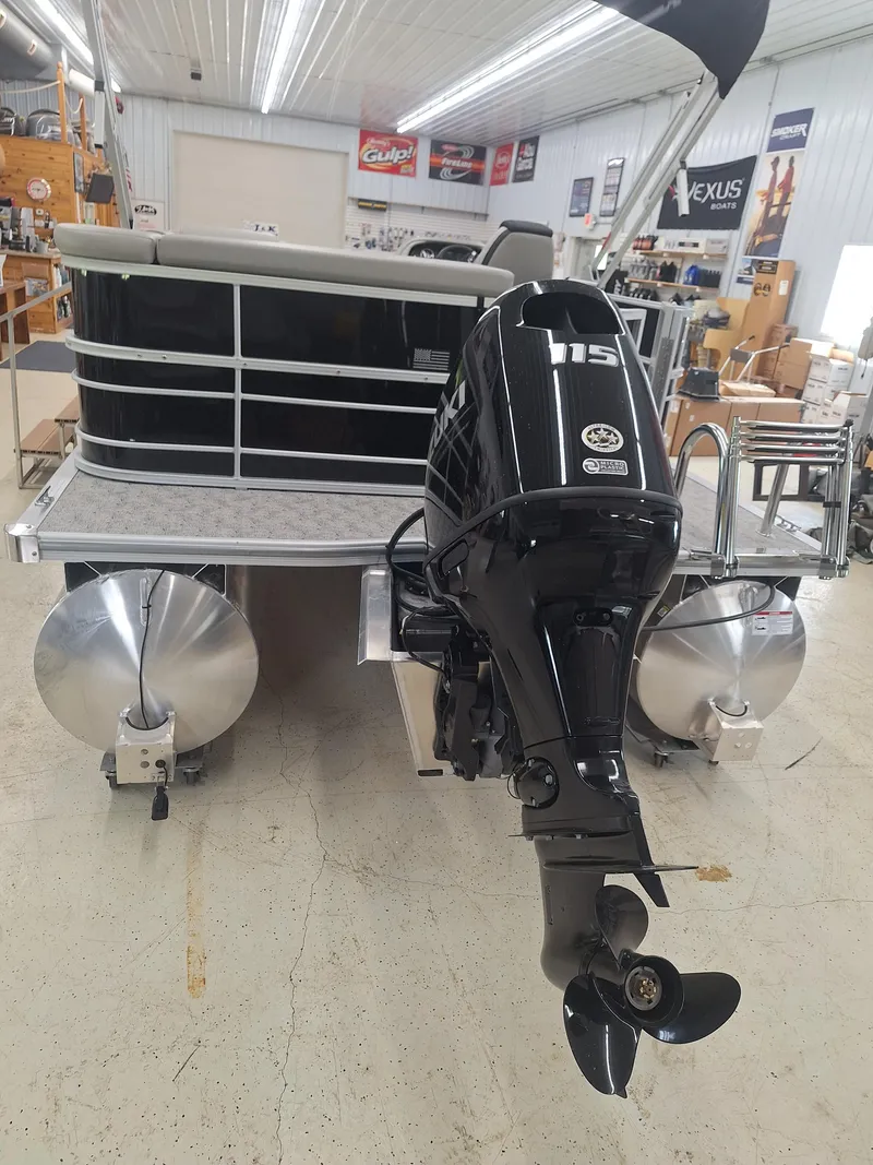 Slide: The Image of 2024 South Bay 222CRLE pontoon boat with outboard motor in showroom. - 13