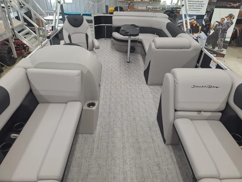 Slide: The Image of 2024 South Bay 222CRLE pontoon boat interior with luxurious seating and modern design. - 2