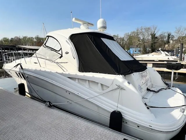 Slide: The Image of 2009 Sea Ray 40 Sundancer yacht docked at marina. - 2