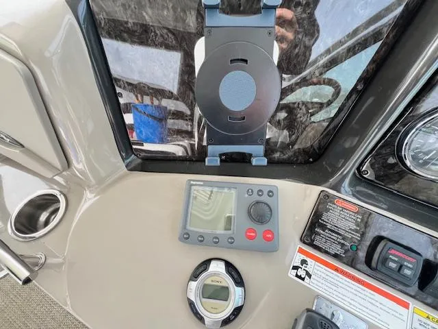 Slide: The Image of Control panel of a 2009 Sea Ray 40 Sundancer boat with navigation and audio equipment. - 21