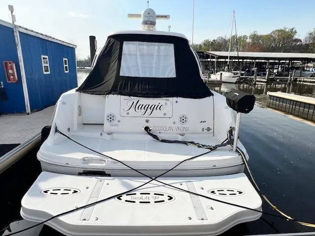 Slide: The Image of 2009 Sea Ray 40 Sundancer docked at marina, rear view. - 3