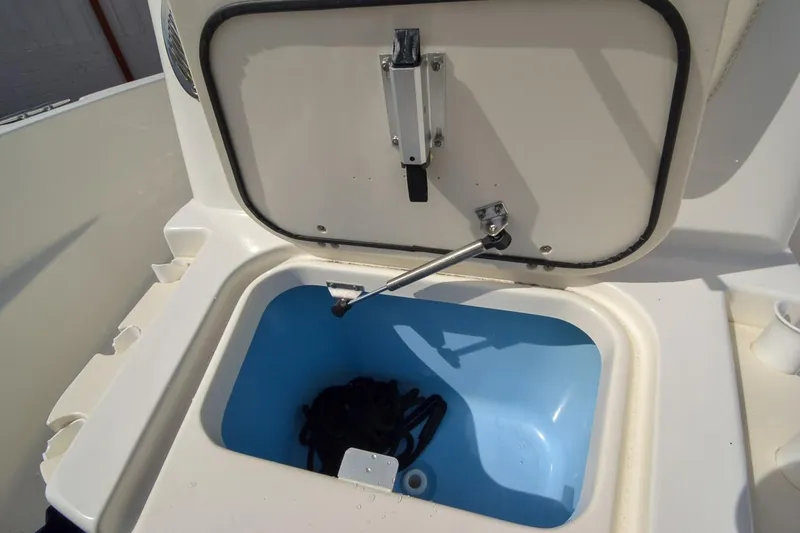 Slide: The Image of Open storage compartment on a 2019 Boston Whaler 180 Dauntless boat. - 12