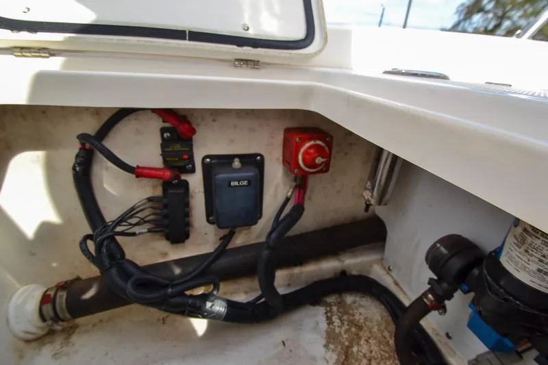 Slide: The Image of 2019 Boston Whaler 180 Dauntless bilge area with wiring and switch components. - 22