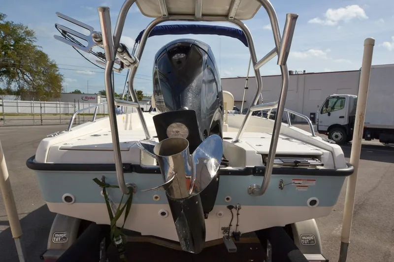 Slide: The Image of 2019 Boston Whaler 180 Dauntless boat rear view with outboard motor. - 5