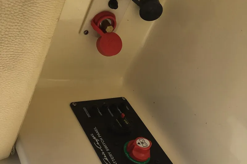 Slide: The Image of 2019 Chris-Craft Launch 27 battery switch panel and controls. - 25