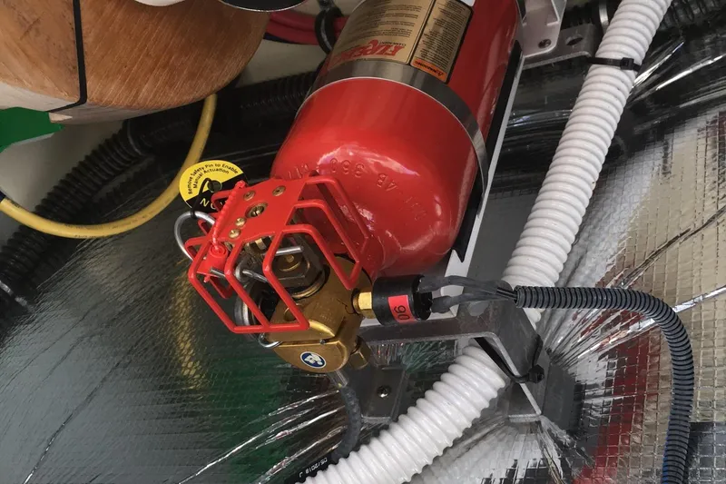 Slide: The Image of 2019 Chris-Craft Launch 27 engine compartment with fire extinguisher system. - 27