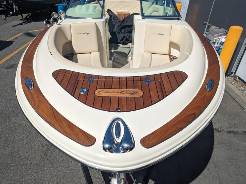 Slide: The Image of 2019 Chris-Craft Launch 27 boat with elegant wood detailing and plush seating. - 3