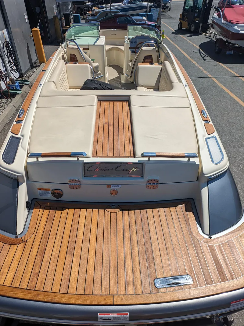 Slide: The Image of 2019 Chris-Craft Launch 27 boat with teak deck and cream upholstery. - 34