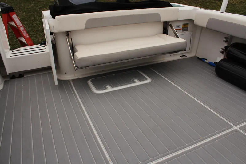 Slide: The Image of 2020 Parker 2520 XL Deep Vee Sport Cabin boat deck with foldable seat and storage. - 12