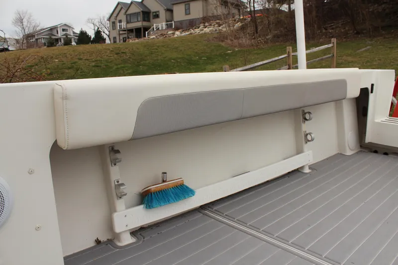 Slide: The Image of 2020 Parker 2520 XL Deep Vee Sport Cabin boat interior with storage and brush. - 17