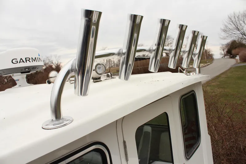 Slide: The Image of 2020 Parker 2520 XL Deep Vee Sport Cabin with rod holders and Garmin equipment. - 27