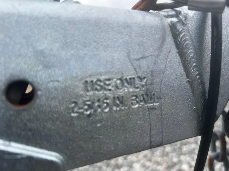 Slide: The Image of Close-up of a Parker 2520 XL Deep Vee Sport Cabin hitch, marked "Use Only 2-5/16 In. Ball." - 41